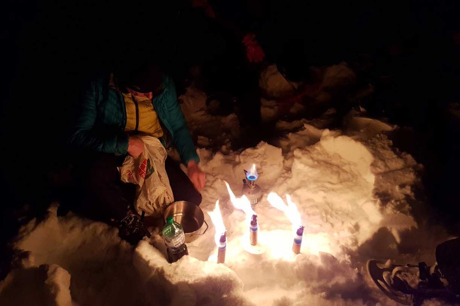 A Torch-Lit Evening on Snowshoes Followed by Dinner at a Mountain Lodge